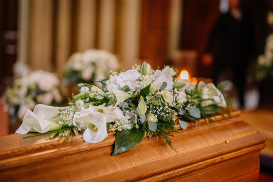 Sympathy floral arrangement with soft white blooms for a guide on choosing a florist for a funeral